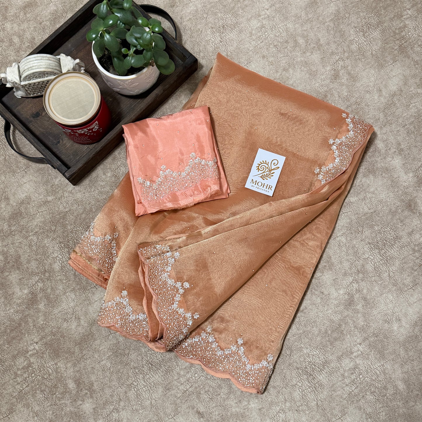 Zardozi work on Peach tissue silk saree